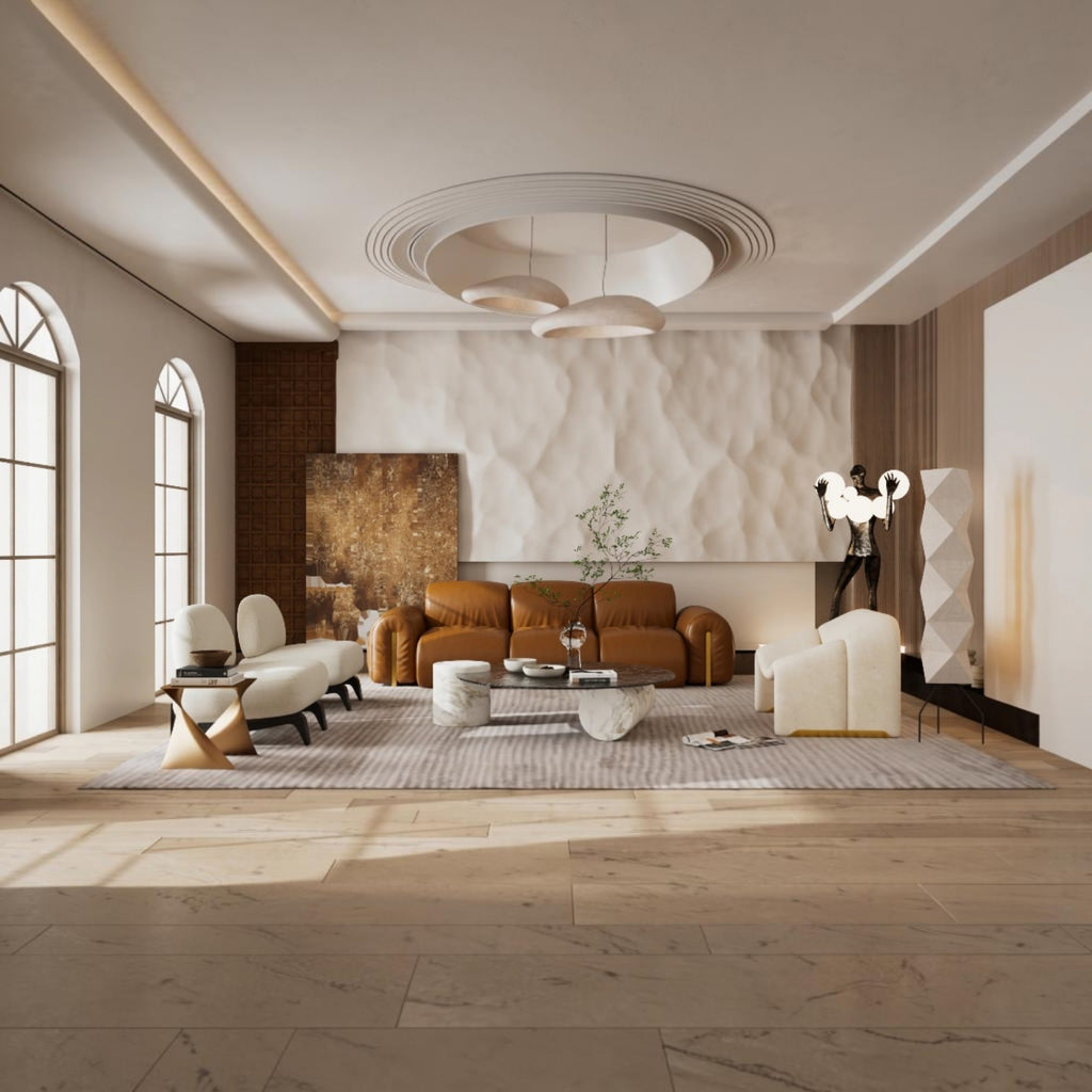 A modern, sunlit living room featuring a warm brown leather sofa, cream accent chairs, a marble coffee table, and a textured beige wall backdrop, with light wood flooring and large arched windows.