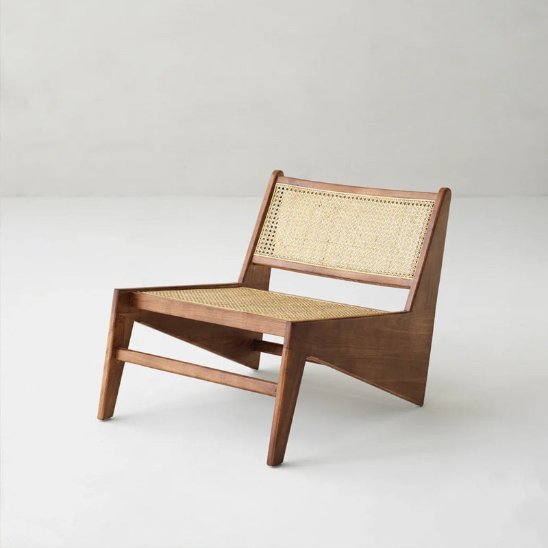 Wooden chair with wicker backrest on a white background
