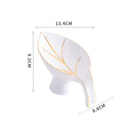 White decorative item with gold accents and dimensions on a white background