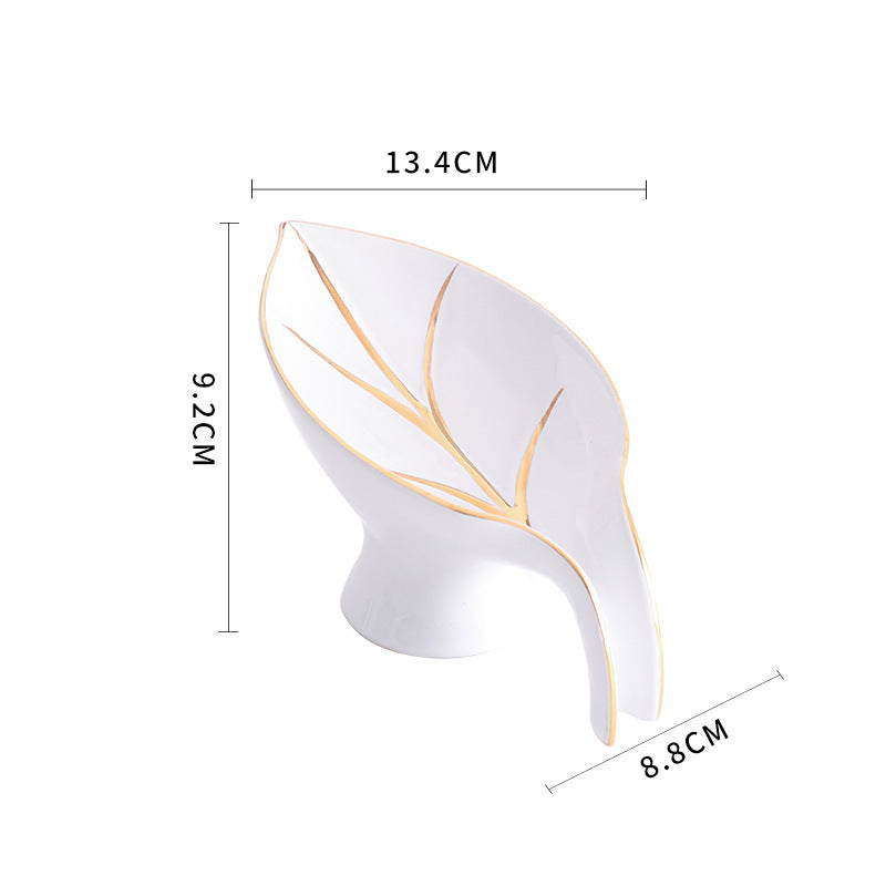 White decorative item with gold accents and dimensions on a white background