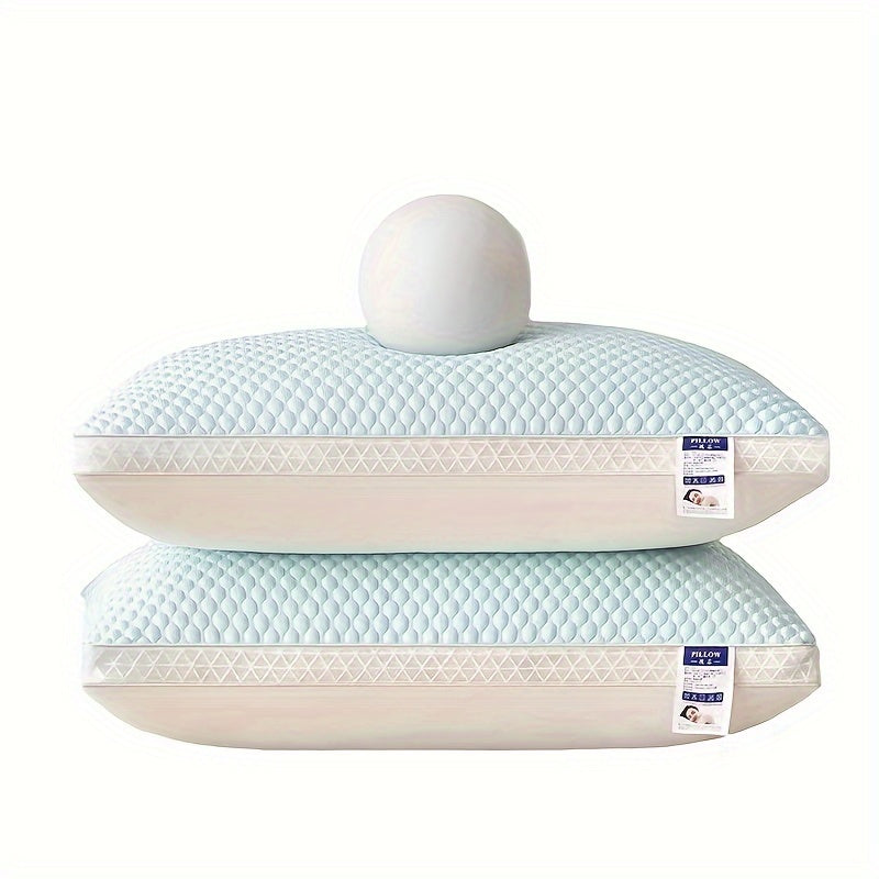 Two light blue pillows with white labels on a white background