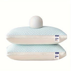 Two light blue pillows with white labels on a white background