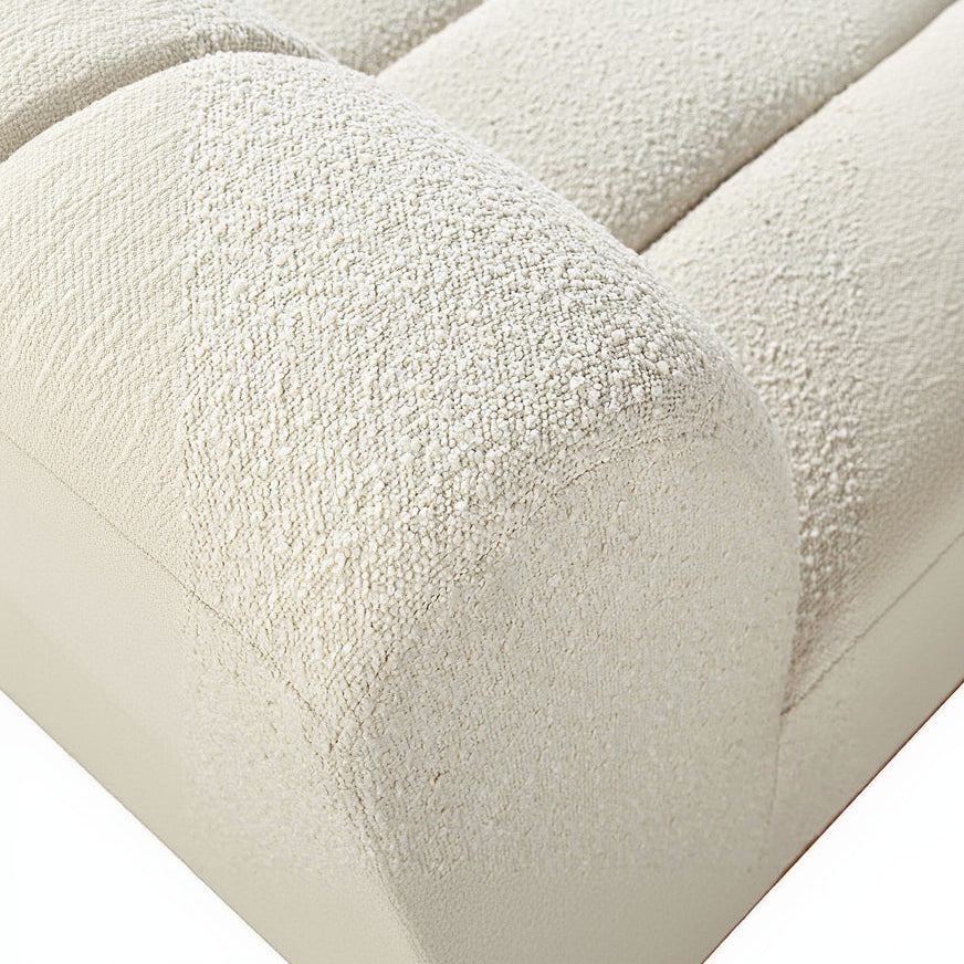Close-up of textured beige fabric with a soft, plush surface.