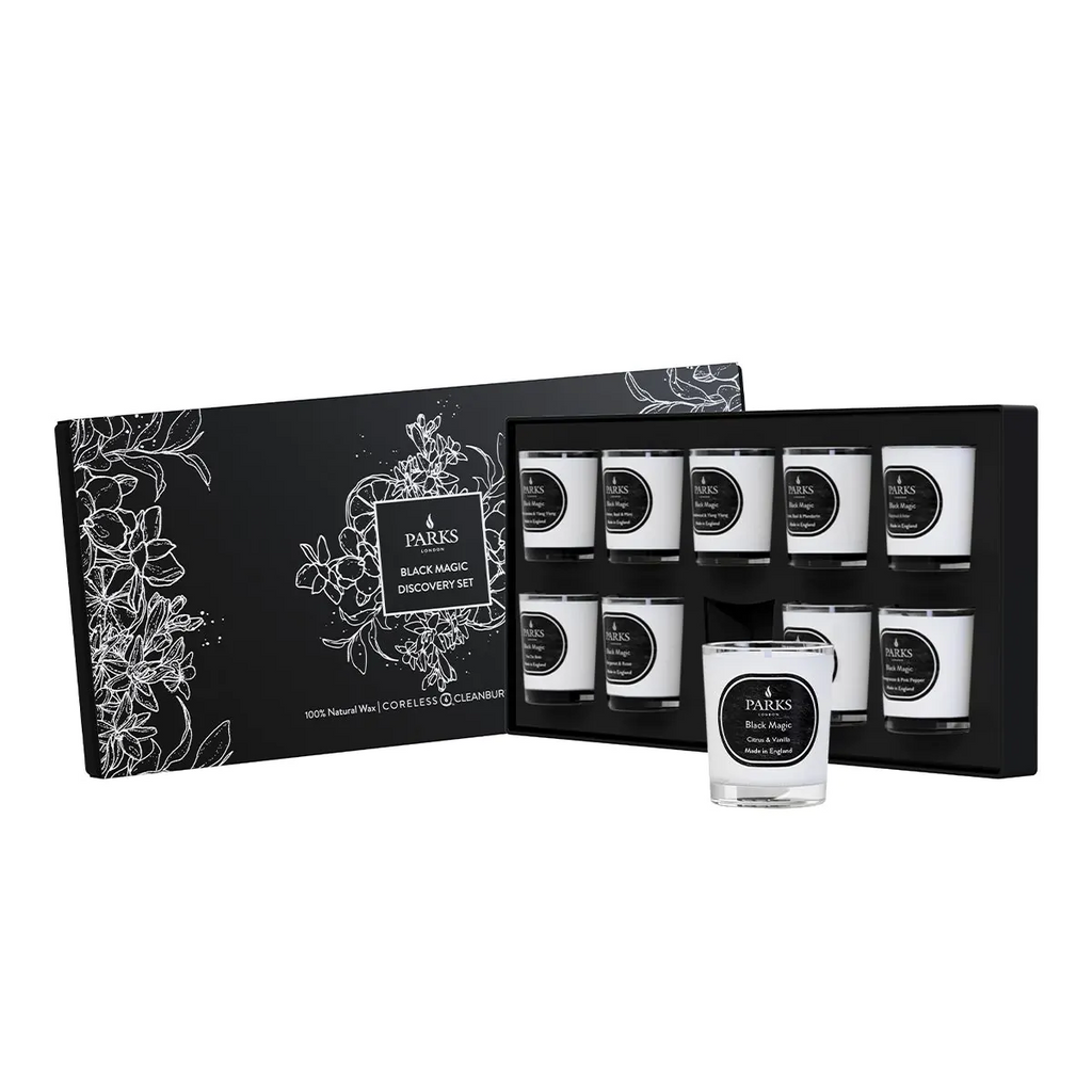 Set of candles in a decorative black box with white text and illustrations on a white background