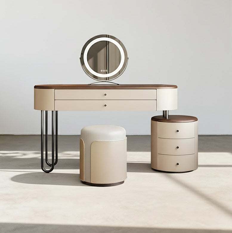 Dressing table with round mirror, stool, and side table on a neutral background