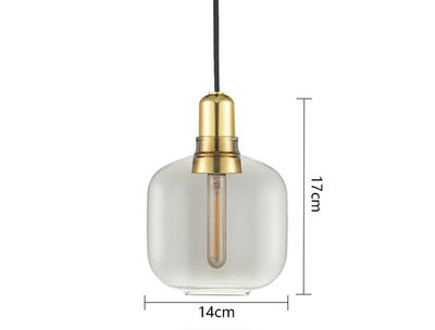 Clear glass pendant light with gold fixture and measurements on a white background