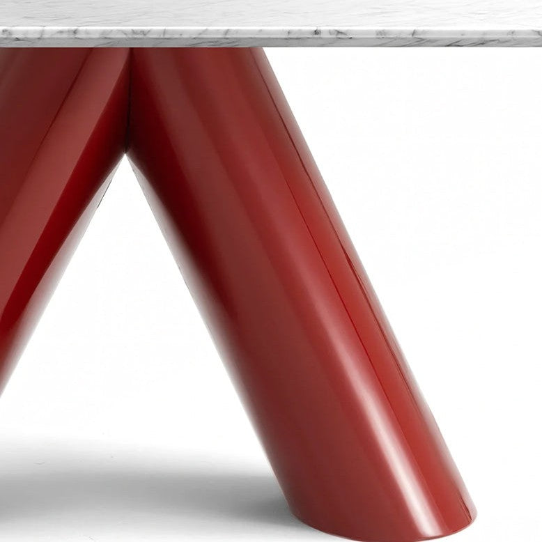 Close-up of a table base with glossy red V-shaped legs and a white marble tabletop edge on a white background.