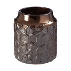 Decorative ceramic vase with textured design on a white background