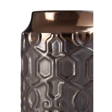 Decorative vase with metallic finish and geometric pattern on a white background