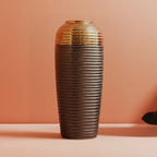 Textured ceramic vase on a matching brown background