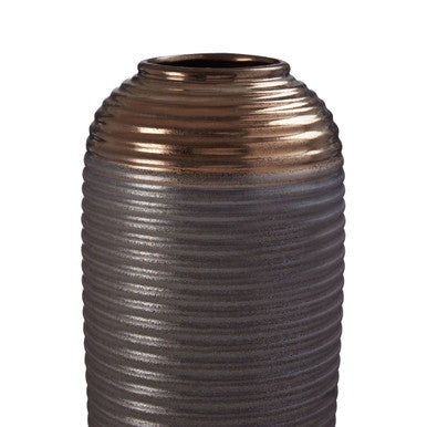 Bronze-colored vase with ribbed texture on a white background