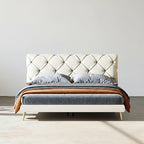 Modern bed with tufted headboard and wooden accents on a plain background