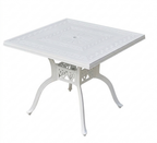 White square table with decorative legs on a white background