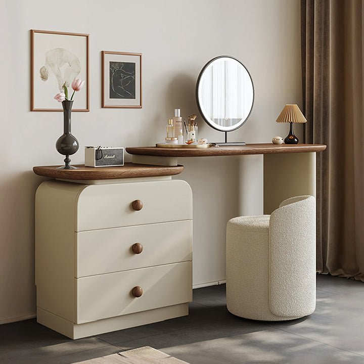 Wooden vanity table with mirror, drawers, and decorative items in a room setting.