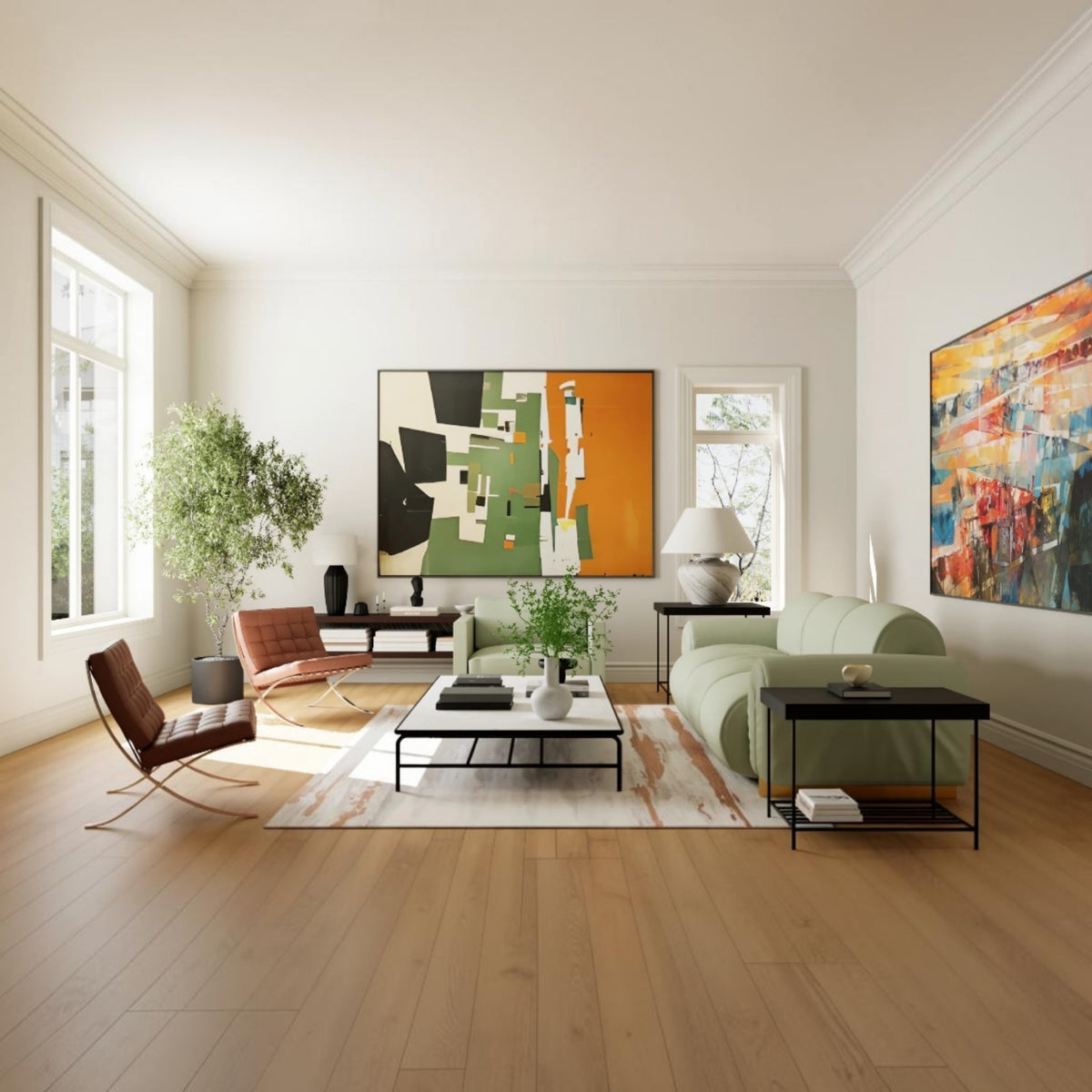 A bright, modern living room with light wood floors, featuring a sage green sofa, a brown leather lounge chair, black side tables, and two large abstract paintings on the walls.