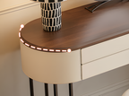 Modern console table with wooden top and decorative lights, featuring a vase on top.