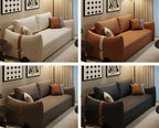 Four different colored sofas in a living room setting with matching armrest designs.