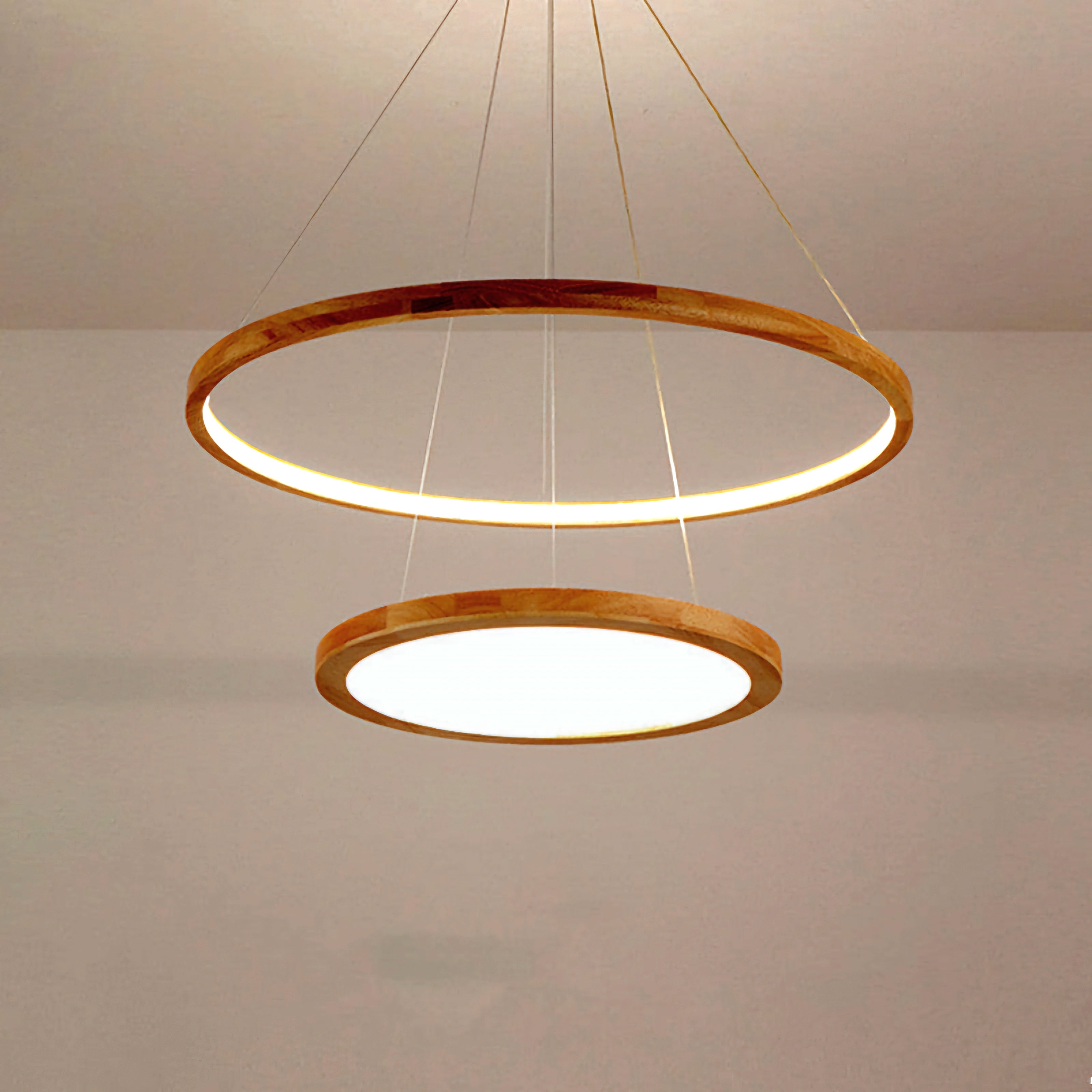 A modern two-tier circular pendant light fixture with natural wood frames and warm white LED lighting, suspended from the ceiling against a neutral wall.