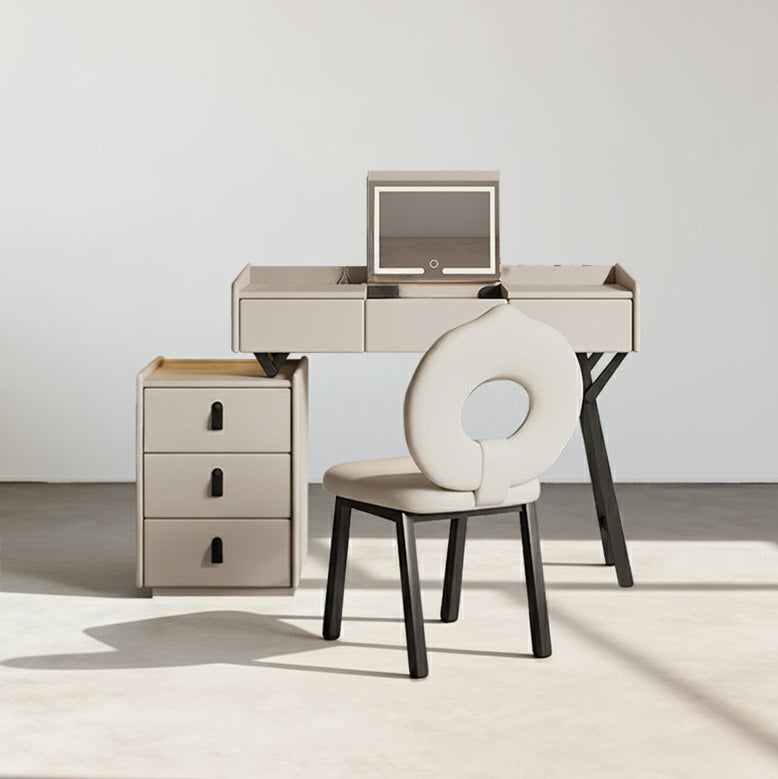 Modern desk with chair and side cabinet against a white wall