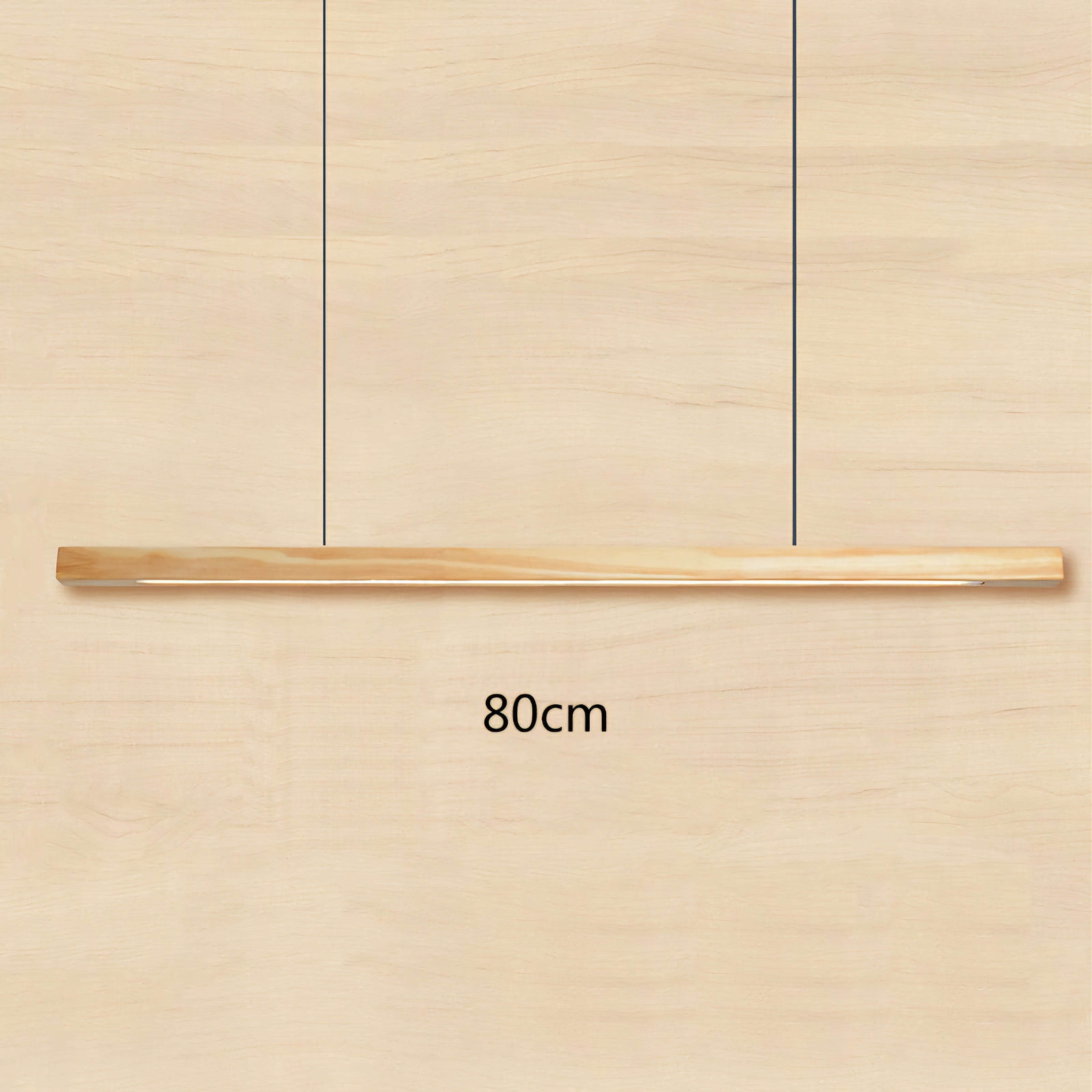 A minimalist linear pendant light with a natural wood finish suspended by two thin black cables, shown against a matching light wood grain background with '80cm' text indicating its width.