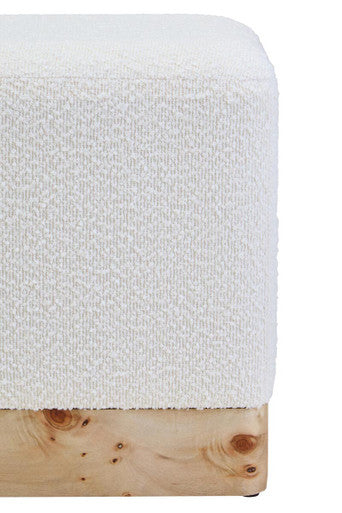 White textured blanket on a wooden surface