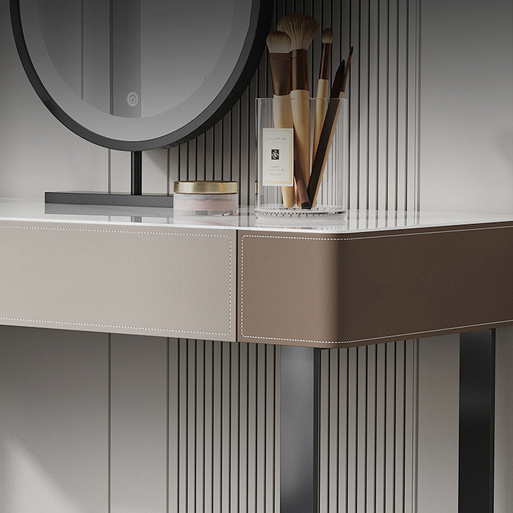 Close-up of a modern vanity with a mirror and cosmetic items.