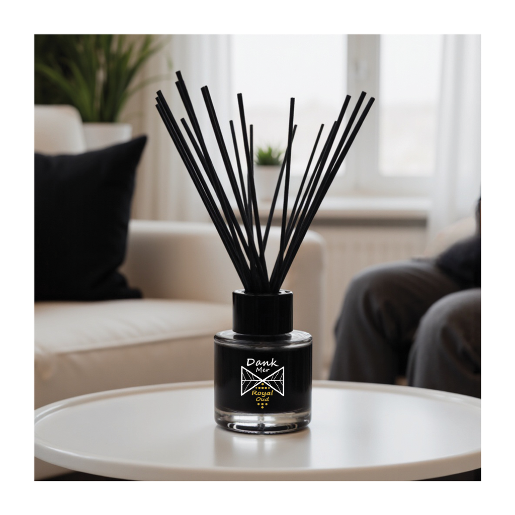 Diffuser with black sticks on a table in a living room setting