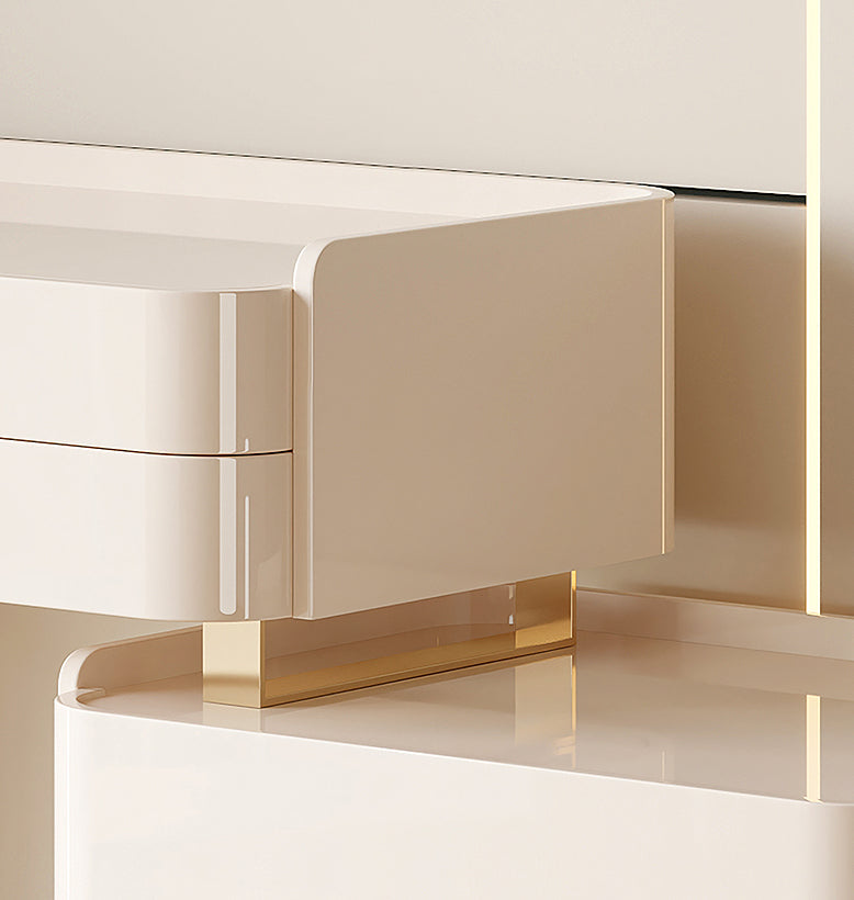 Beige furniture piece with gold accents on a light background