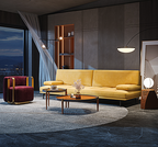 Modern living room with yellow sofa, red armchair, and wooden coffee table.