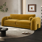 Yellow sofa in a modern living room with a coffee table and decorative elements.