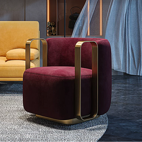 Maroon armchair with gold accents in a modern interior setting