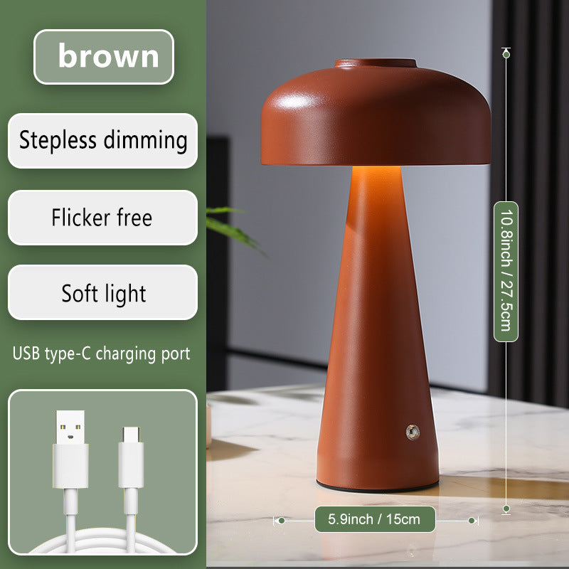 Brown table lamp with USB charging port on a wooden surface, featuring text on its benefits.