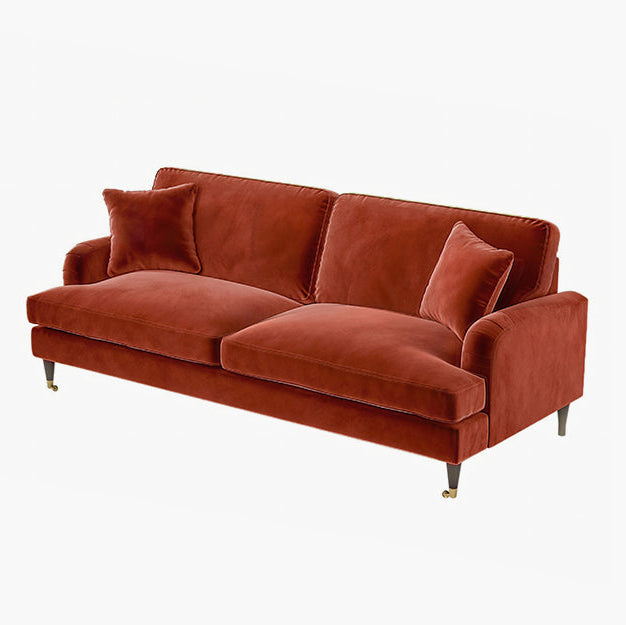 Brown sofa with cushions on a white background