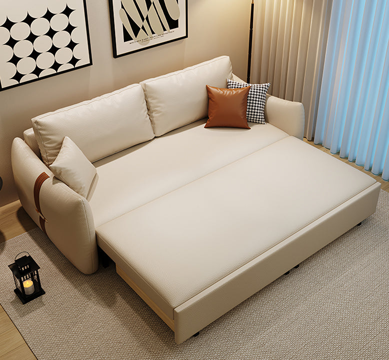 Beige sectional sofa with decorative pillows in a living room setting.