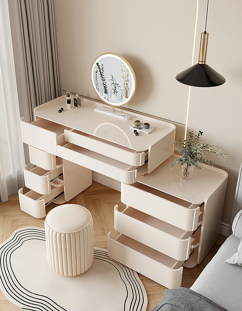 Modern white vanity table with mirror and stool in a room setting