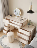 Modern white vanity table with mirror and stool in a room setting