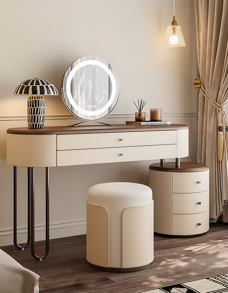 Dressing table with mirror, lamp, and stool in a bedroom setting