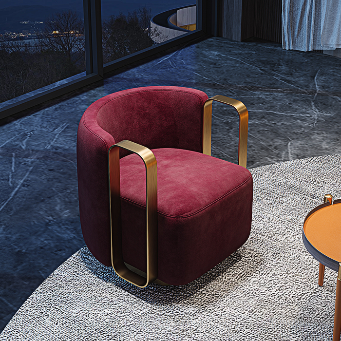 Red velvet chair with gold accents in a modern interior setting