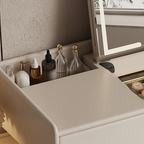 Cosmetic drawer with various bottles and a mirror on a vanity unit.