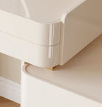 Close-up of a white curved desk with a gold accent