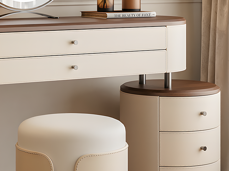 White vanity desk with wooden top and matching round stool against a neutral wall.