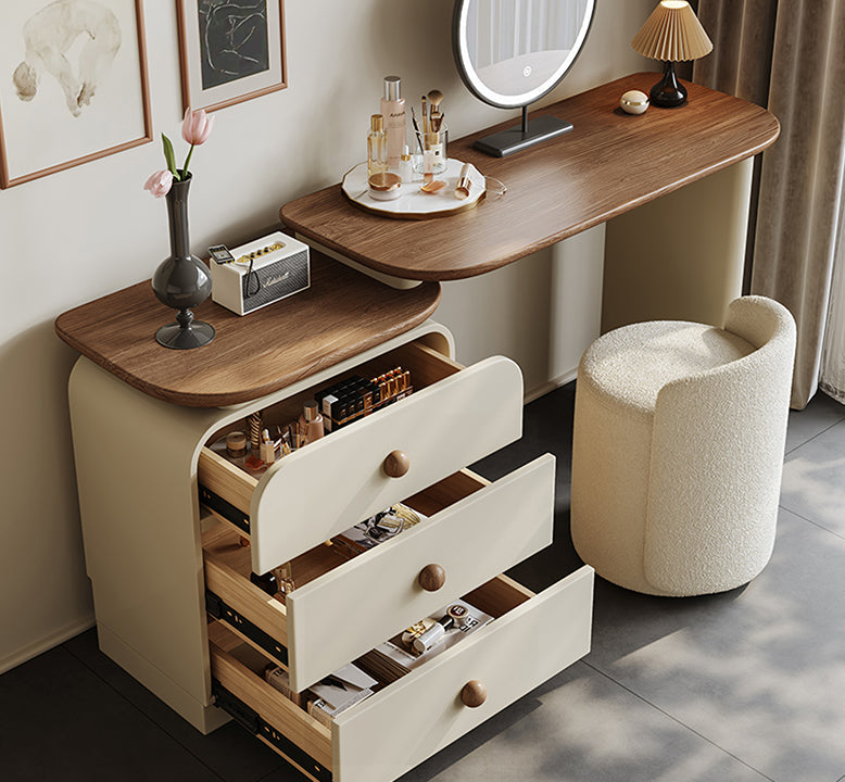 Wooden vanity table with open drawers in a room setting