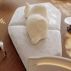 Modern white sofa with unique backrest design on a wooden floor