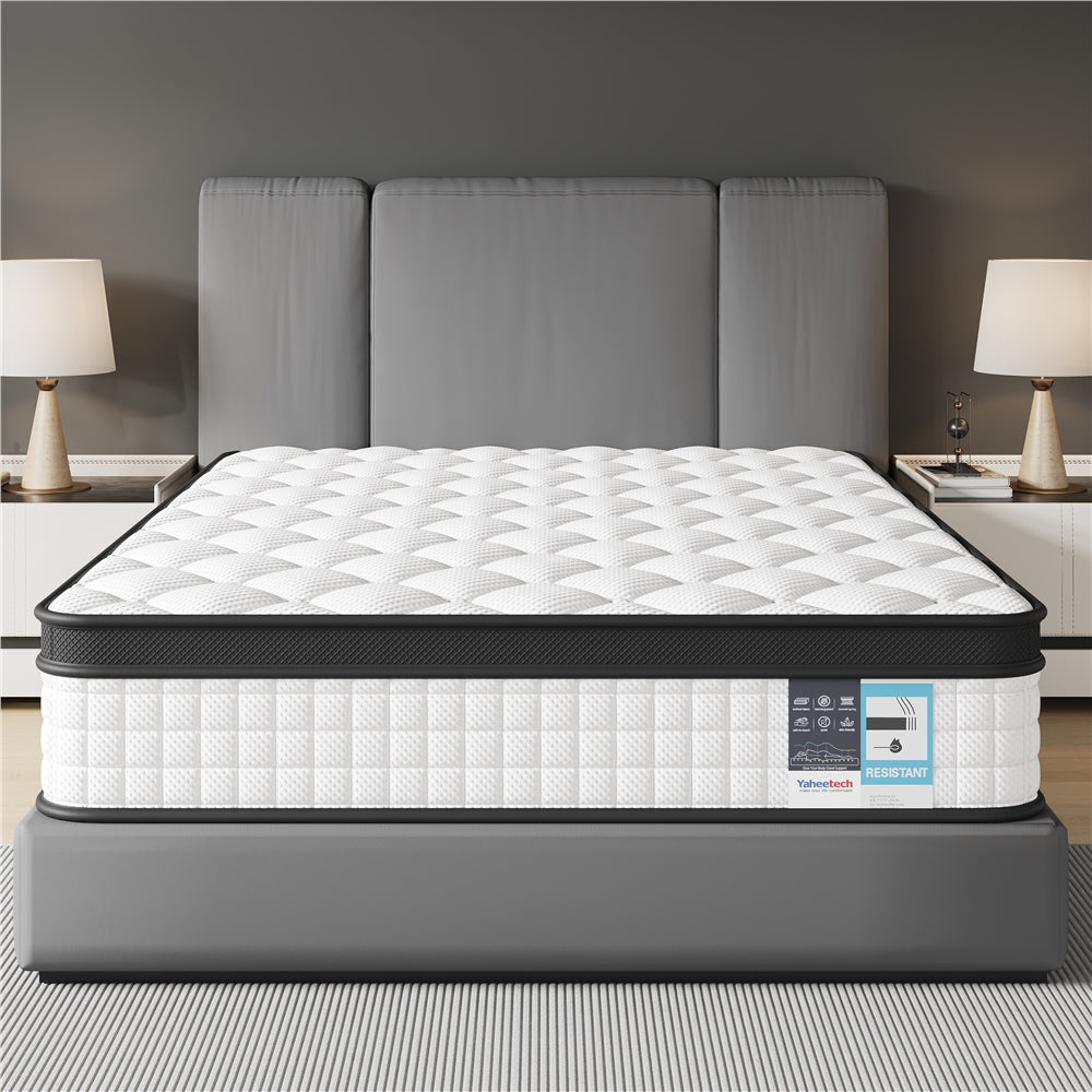 Mattress on a bed frame with a gray headboard in a bedroom setting