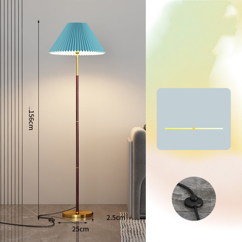 Floor lamp with pleated blue shade and measurements on a neutral background