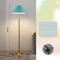 Floor lamp with pleated blue shade and measurements on a neutral background