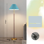 Floor lamp with pleated blue shade and measurements on a neutral background