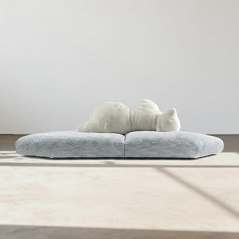 Modern gray sofa with a white cushion on a neutral background