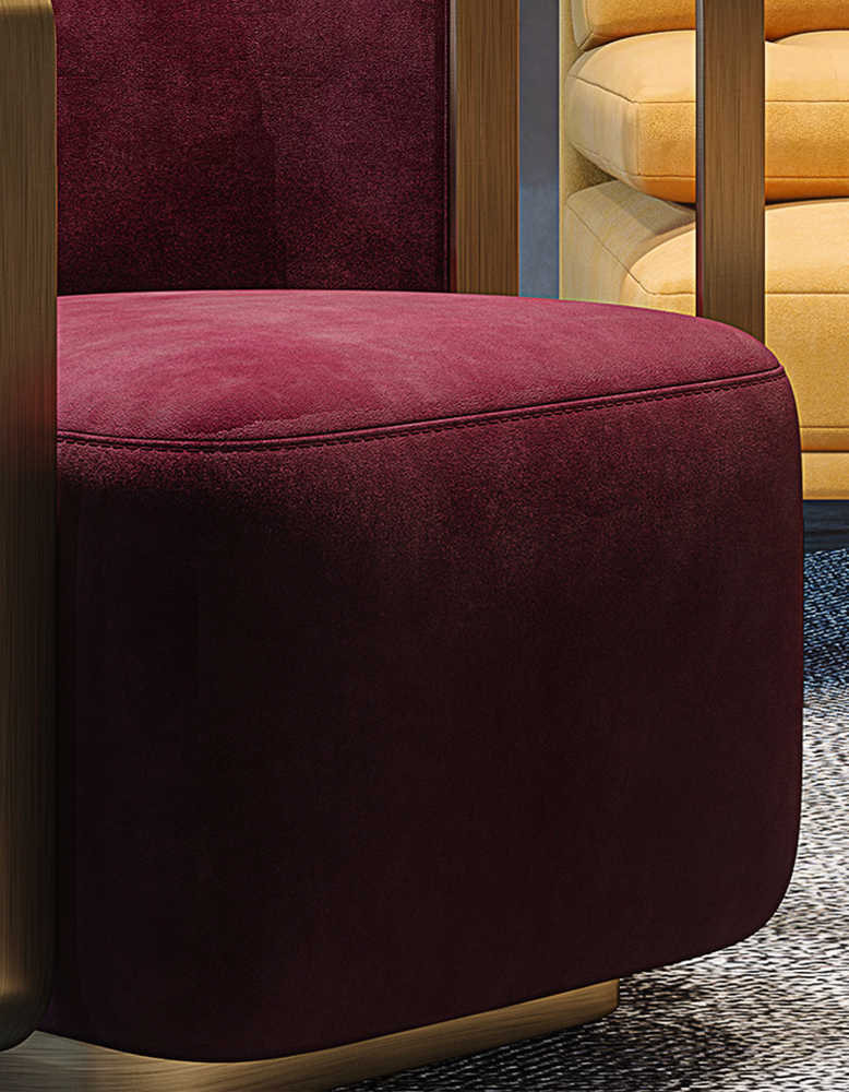 Close-up of a maroon armchair with a blurred background