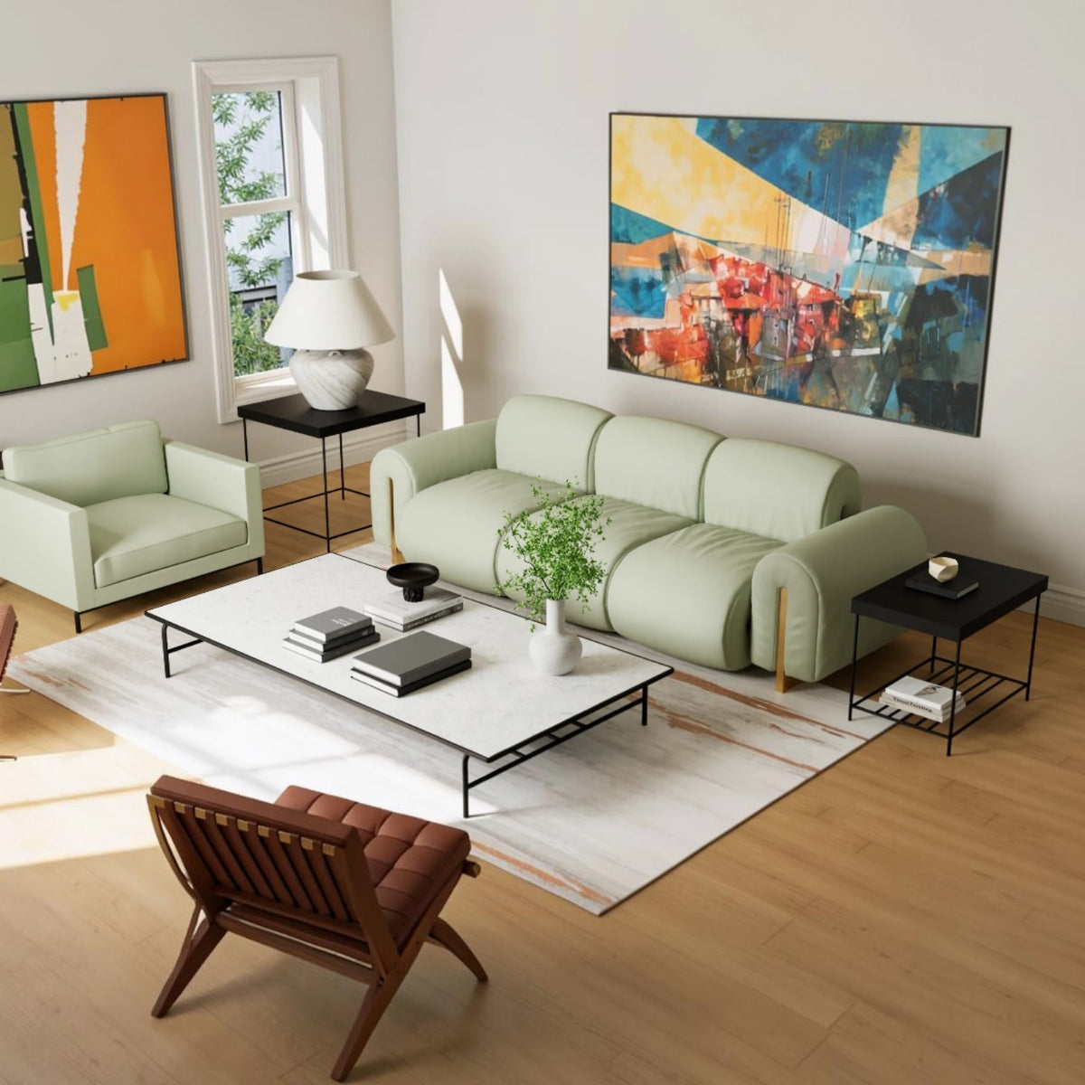 A modern living room featuring a light sage green modular sofa as the main product, styled with a white coffee table, black side tables, a brown leather chair, and colorful abstract wall art on a light wood floor.